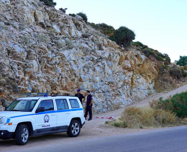 NO ARCHIVE.Police officers block the road towards the area where the body of missing 35-year-old British Natalie Christopher was found on the island of Ikaria. Photo: Reuters