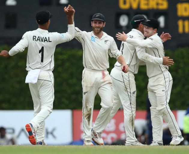 Kane Williamson celebrates with his Black Caps team mates during the second test win over Sri...