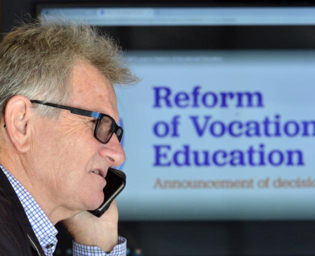 Otago Polytechnic chief executive Phil Ker takes a phone call after learning details of the...