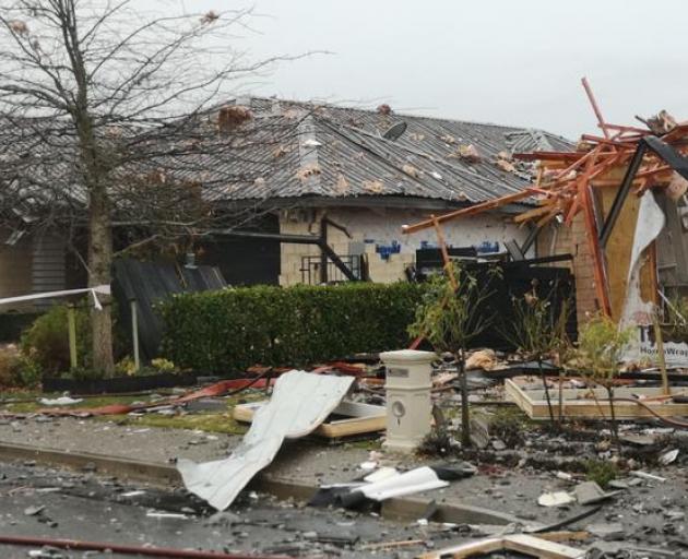 Several homes in Northwood, near the site of a gas explosion which completely destroyed a house, are likely uninhabitable. Photo: Logan Church/RNZ