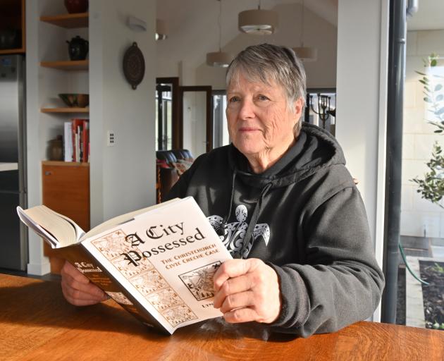 Dunedin author Dr Lynley Hood with her book A City Possessed: The Christchurch Civic Creche Case,...