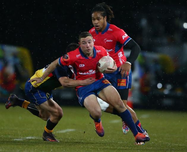 Mitchell Hunt tries to break a tackle for Tasman against the Sassenachs in their preseason game...