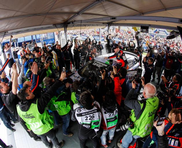 The Hyundai Motorsport team at the service park celebrate Paddon's 2016 win at Rally Argentina....