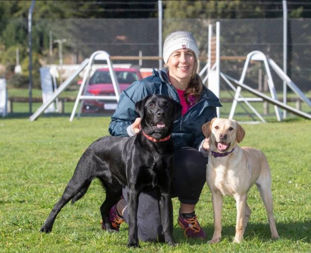 Erin Moyle, with Marco, left, who failed as a police dog, and Poppy, who is currently in training...