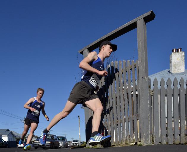 Janus Staufenberg keeps close to the fence line as he turns from Plunket St into Richardson St...