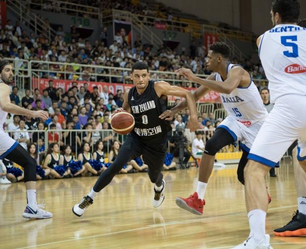 Tai Webster drives to the hoop for the Tall Blacks against Italy. Photo: Getty Images