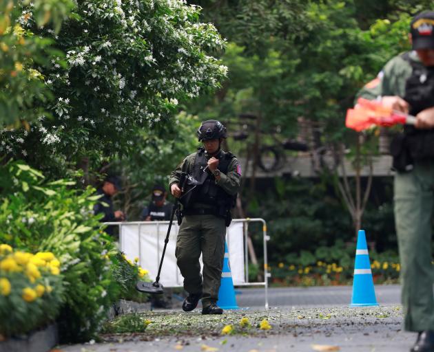 Police Explosive Ordnance Disposal (EOD) officers work following a small explosion at a site in Bangkok. Photo: Reuters