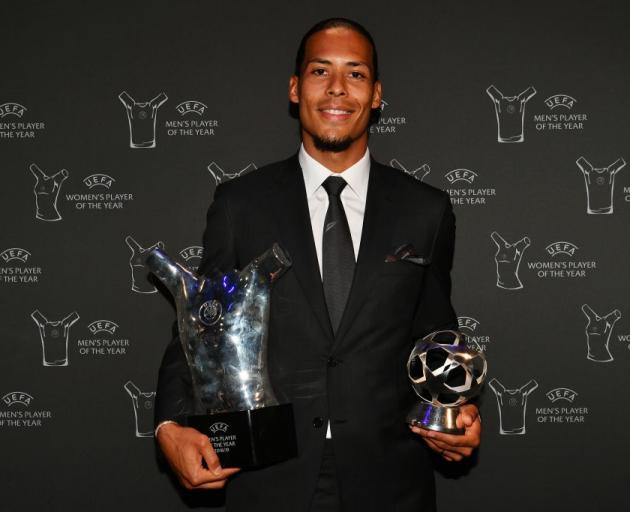 Virgil van Dijk with the UEFA men's player of the year awards. Photo: Getty Images
