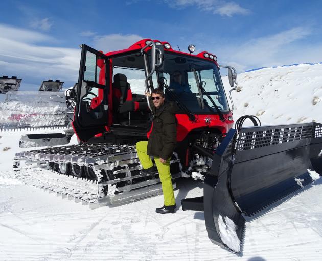 John Wilson, of the Otago Community Trust, about to go for a ride on the new Snow Farm groomer, ...