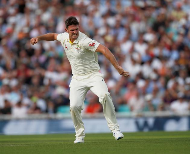 Australia's Mitchell Marsh celebrates taking the wicket of England's Sam Curran. Photo: Reuters