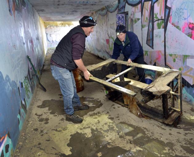 Otago Peninsula Community Board chairman Paul Pope (left) and board member Graham McArthur clean...