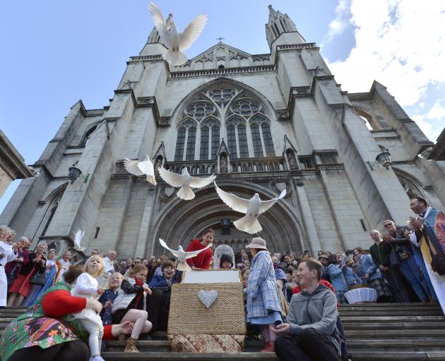 Doves fly from St Paul's Cathedral, Dunedin, after a special service yesterday to mark the 150th...