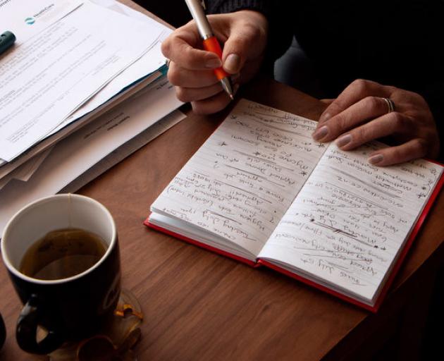 Teresa Gooch keeps track of the dozens of jobs she's applied for in a notebook - crossing out the entries when she doesn't hear back, or misses out. Photo: RNZ / Kate Newton