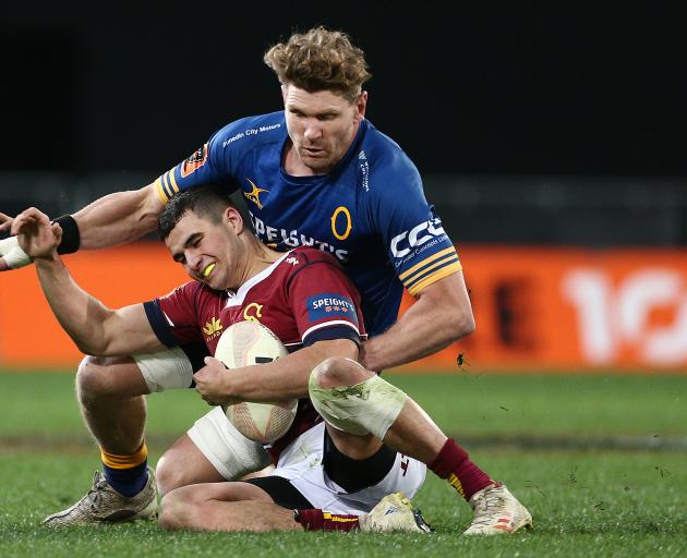Veteran loose forward Adam Thomson makes a tackle during Otago's successful defence of the...
