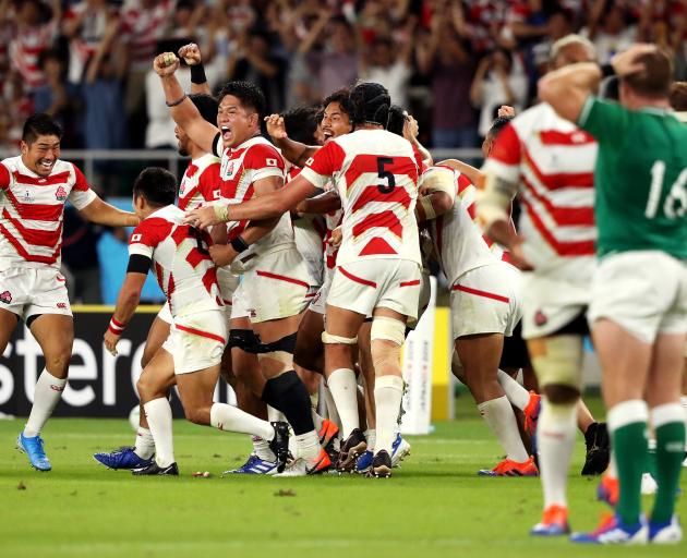 Japan celebrate their monumental win over Ireland in the Rugby World Cup. Photo: Getty Images