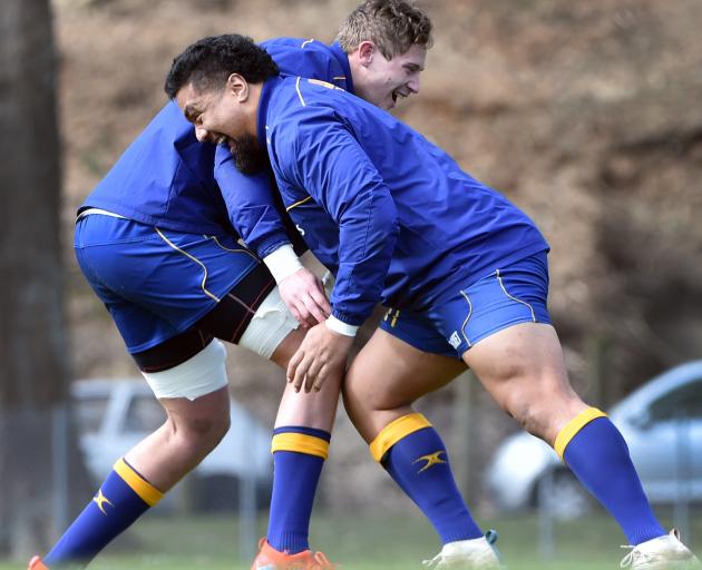 Otago prop Hisa Sasagi (right) thumps into team-mate Louis Conradie during a training session at Logan Park yesterday. Photo: Peter McIntosh