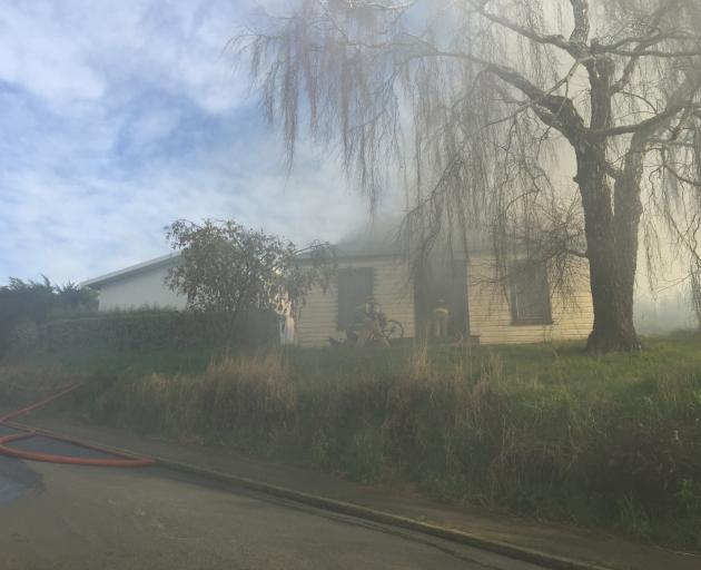 Firefighters are battling a blaze on Rockside Rd. Photo: Gregor Richardson