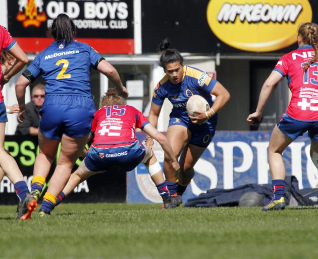 Otago Spirit midfielder Kilisitina Moata’ane runs at Tasman defender Bethan Manners during their Farah Palmer Cup match in Oamaru on Saturday.  Watching on are (from left) Pippa Andrews, Tegan Hollows (Otago) and Wairakau Greig. Photo: Phil Janssen