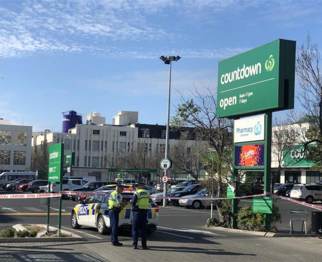 Police block one of the entrances to Countdown supermarket in central Dunedin. Photo: Craig Baxter 