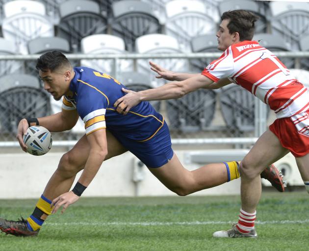 Otago Whalers wing Willie Time brushes past West Coast’s Navare Jacobs to score in the corner...
