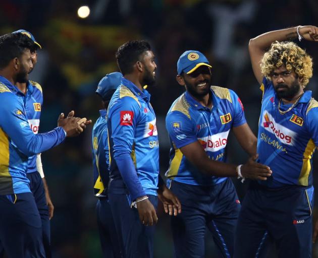 Lasith Malinga of Sri Lanka celebrates with team mates he after takes wicket of Ross Taylor during the Twenty20 International match between Sri Lanka and New Zealand. Photo: Getty Images