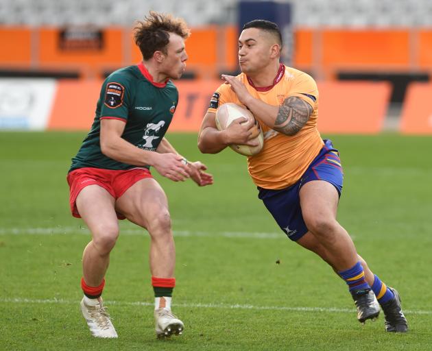 Wairarapa Bush winger Logan Hebenton-Prendeville (left) sizes up  North Otago second five-eighth...