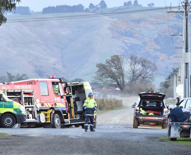Emergency services attend a fatal crash near Outram yesterday. PHOTO: GREGOR RICHARDSON