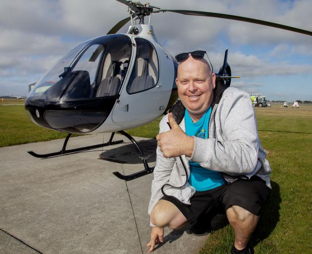 Paul Matheson in front of Christchurch City Helicopters modern Guimbal Cabri G2 helicopter before...