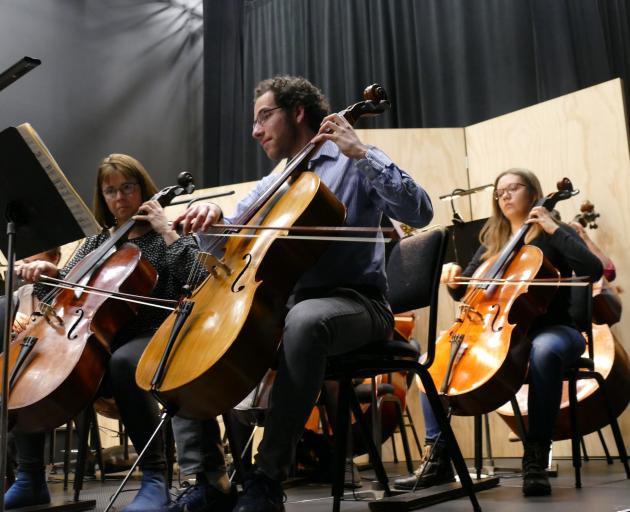 Joshua Ferrer, principal player in the Dunedin Symphony Orchestra's cello section, performs at...