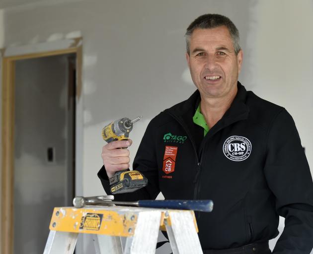 Helping hammer down building costs. PHOTO: PETER MCINTOSH