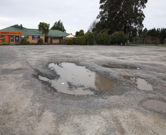 Potholes in the West Melton Tavern car park have caused a dispute between the leasees and landlord. Photo" Geoff Sloan. 