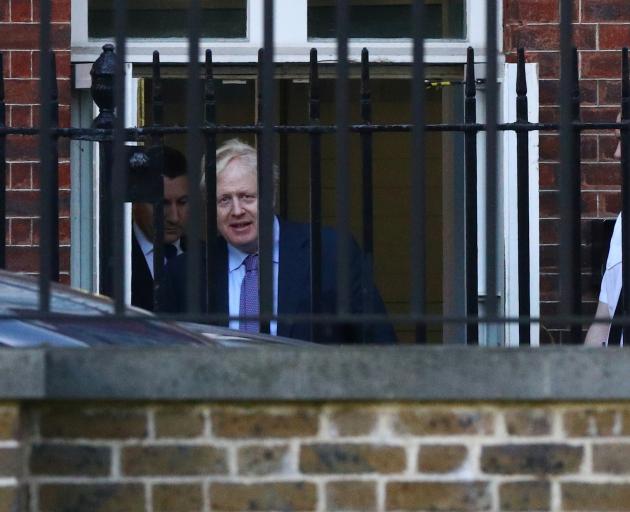 UK Prime Minister Boris Johnson is seen leaving Downing St following Brexit negotiations. Photo:...