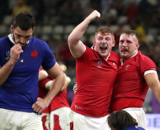 Wales' Aaron Wainwright celebrates with team mates after the match. Photo: Reuters 