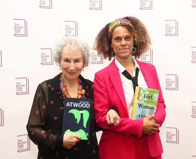 Margaret Atwood poses with Bernardine Evaristo after jointly winning the Booker Prize in London on Monday. Photo: Reuters