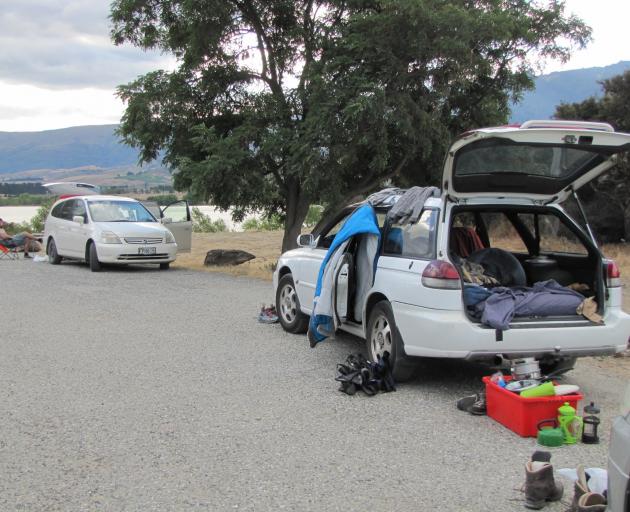Freedom campers at Bendigo during a previous summer overlook Lake Dunstan. Freedom camping is one...