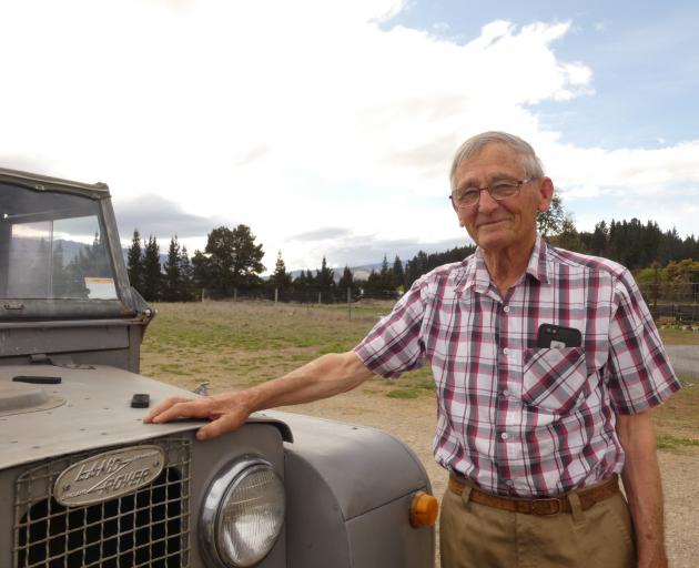 Alexandra's Dave Sinclair stands next to one of five Land Rovers he is selling at auction. Photo: Adam Burns