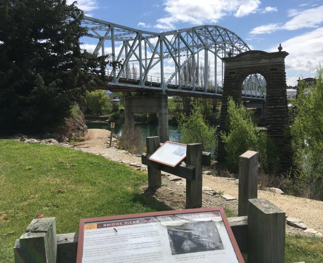 Alexandra's old bridge piers overlook the junction of three cycling trails. The town is part of...