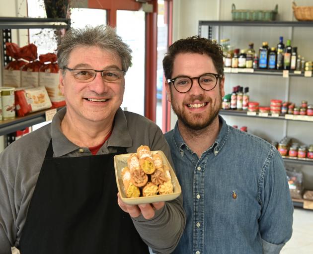 Artisan pantry owner Vito Iannece (left) and operations and marketing manager Charlie Buchan, with a tray of cannoli, which will become a ``signature'' dish at Vito's Cafe. Photo: Linda Robertson