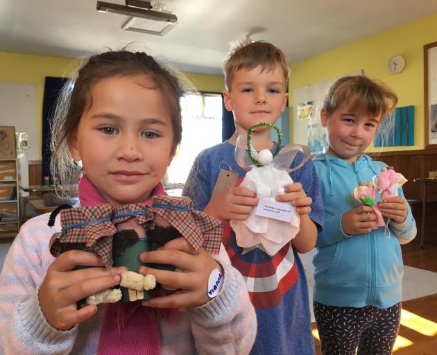 Vienna Apireru, 5, Asher Van Asperen, 7, and Ella Mead, 7, with the three types of angels made...