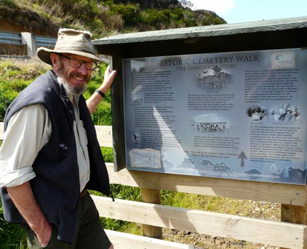 Project spokesman Fergus Sutherland inspects one of two new interpretation panels at the Chaslands Heathfield Cemetery, which will be reopened on Saturday. Photo: Richard Davison