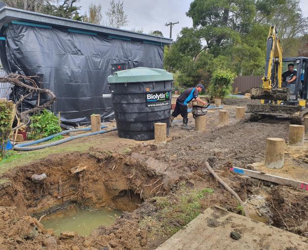 Foundations go in and a septic tank is installed in readiness for the climate safe house in...