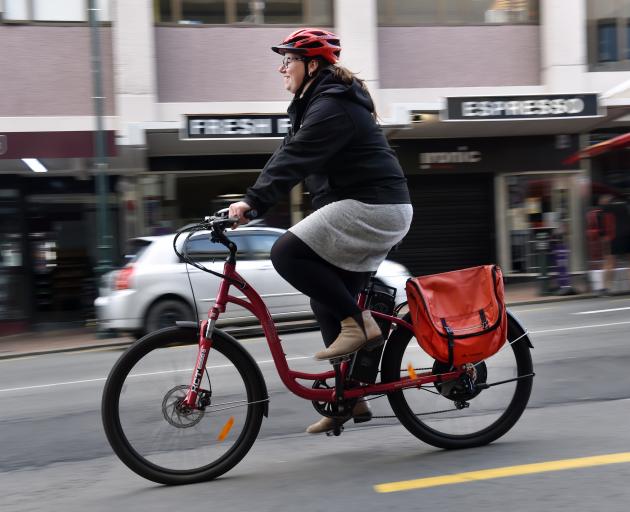 Whizzing along George St is Dunedin City Council staffer Stacey Hitchcock on the council's work e-bike. Photo: Peter McIntosh