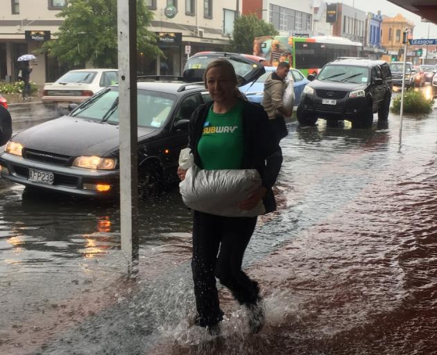 Surface flooding inundated Gordon Rd in Mosgiel this afternoon. Photo: Stephen Jaquiery