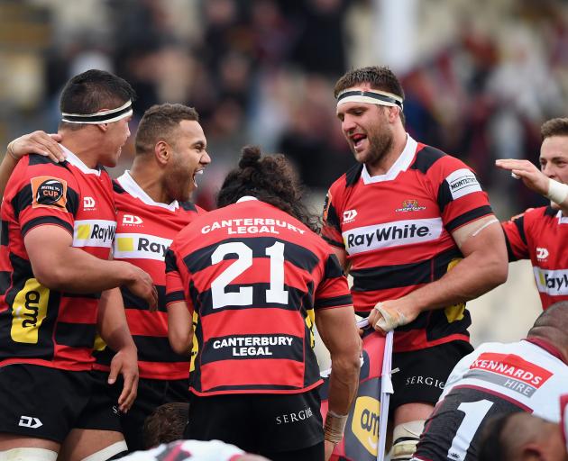 Relieved Canterbury players celebrate their late win over North Harbour. Photo: Getty Images 