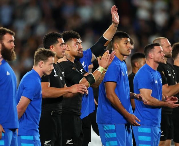 All Blacks players thank the fans after their semi-final loss to England in Yokohama. Photo:...