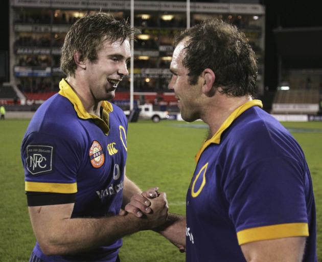 Otago's Matt Saunders (left) and Anton Oliver celebrate beating Canterbury 37-22 in an NPC...