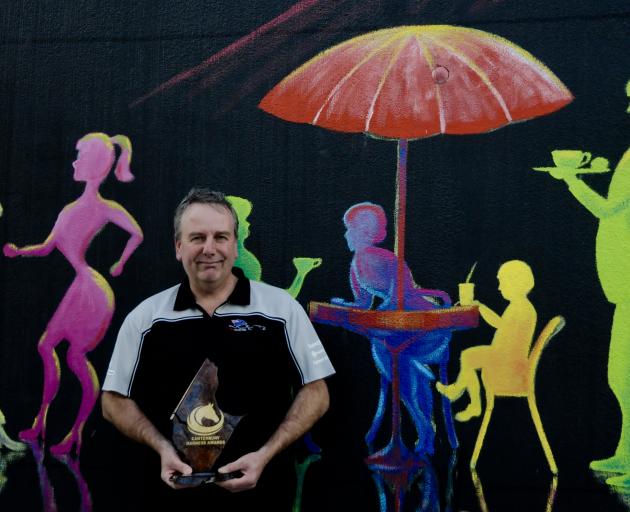 Amberley Trotting Club president Ross Rennie at the Rangiora Raceway last Sunday with his trophy for Volunteer of the Year Award, presented to him at the recent Canterbury Harness Racing Awards dinner. Photo: Shelley Topp