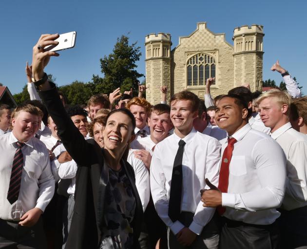 Prime Minister Jacinda Ardern takes a selfie with Waitaki Boys' High School pupils during a visit to the school in 2018. Photo: Gregor Richardson
