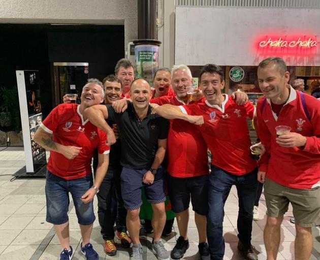 Referee Jaco Peyper poses with Welsh fans following Sunday's Rugby World Cup quarterfinal between...