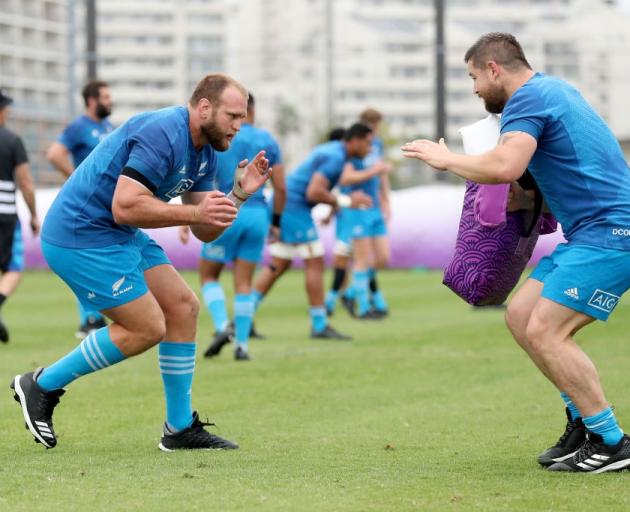 All Blacks prop Joe Moody prepares to make a tackle in training against Dane Coles. Photo: Getty...